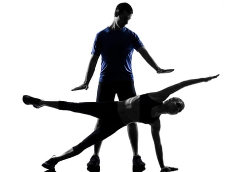 couple woman man exercising workout fitness aerobics posture in silhouette studio isolated on white background