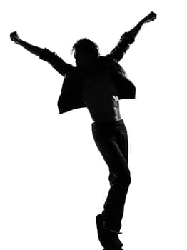 full length silhouette of a young man dancer dancing funky hip hop r&amp b on  isolated  studio white background