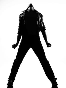 full length silhouette of a young man dancer dancing funky hip hop r&amp b on  isolated  studio white background