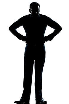 one caucasian man angry hands on hips full length silhouette in studio isolated white background