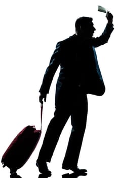 one caucasian business traveler man walking with suitcase hurrying late  full length silhouette in studio isolated white background