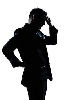 one caucasian man portrait silhouette tired migraine backache in studio isolated on white background
