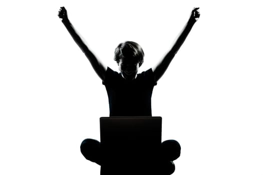 one caucasian young teenager silhouette boy  girl computer computing laptop happy success full length in studio cut out isolated on white background