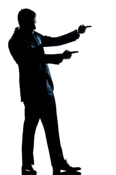 one caucasian man showing pointing empty copy space  full length silhouette in studio isolated white background