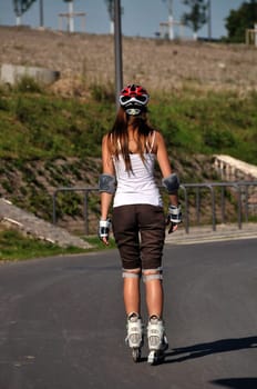 Woman driving in the opposite direction of the camera