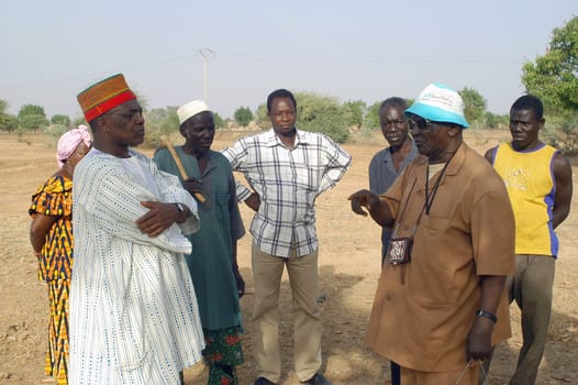 African waterfinder with work in an area of Burkina Faso Faso. Water is not rare in Africa, only it is necessary to drill wells to reach it. The waterfinder thus determines the place exact where to drill because drilling costs 8000 ? and it is not questio