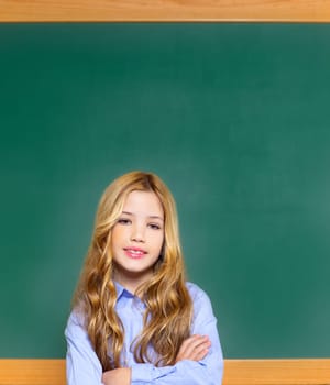 kid student girl on green blackboard posing with smile