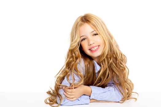blond kid little student girl portrait smiling on a desk in white background