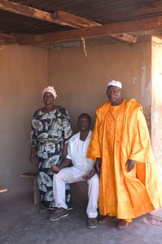 African family of Burkina Faso in front of their house with Ouagadougou