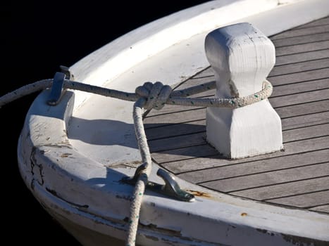 ropes on the boat docked in the harbour