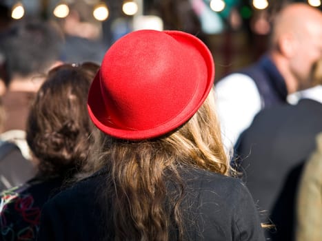 blonde woman with a red hat