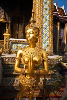 a kinaree, a mythology figure, is watching the temple in the Grand Palace