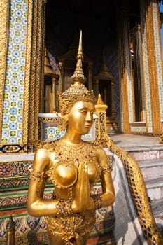 a kinaree, a mythology figure, is watching the temple in the Grand Palace