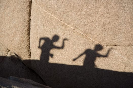 shadow game of children with Scenic rocks  in Joshua tree national park