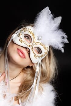 Young attractive girl in a fluffy boa