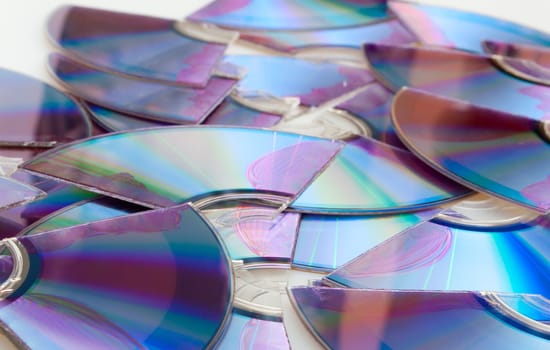 Background of Pieces of Broken CD Compact Discs