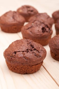 Close Up of Chocolate Muffins on Wooden Table