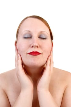 A closeup portrait of a pretty woman, her eyes closed and her hands on her chicks, with red lips for white background.