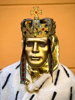 men with the golden mask on the street