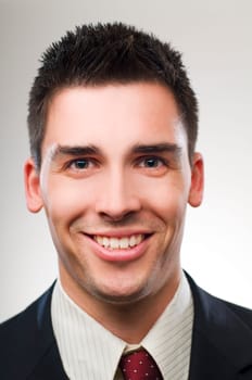 Young happy business man close up portrait
