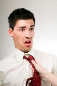 Womans hand pulling business man close up shoot
