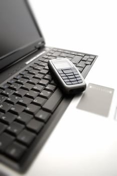 cell phone on laptop computer close up shoot