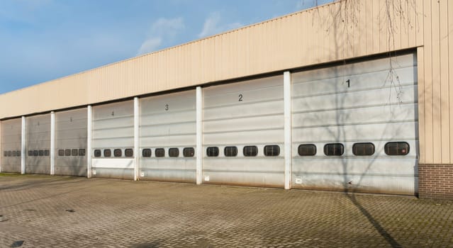 industrial unit with old and damages roller shutter doors