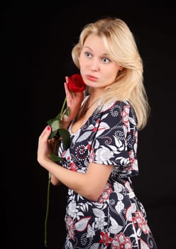 Young blonde woman with red rose.