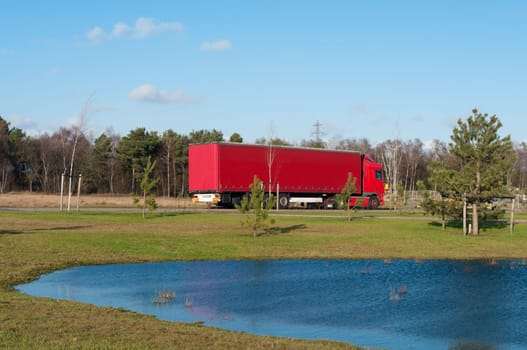 red polish truck waiting for work on an industrial area in the netherlands