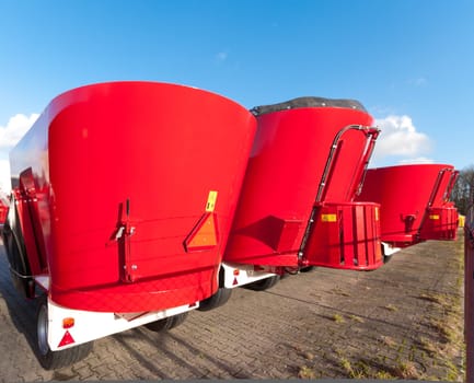 new agricultural feeding and mixing machines ready to be transported