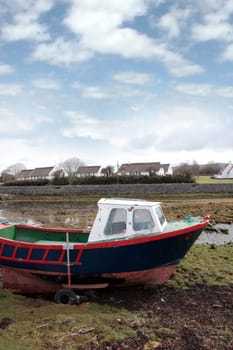 an old boat in a bay in ireland
