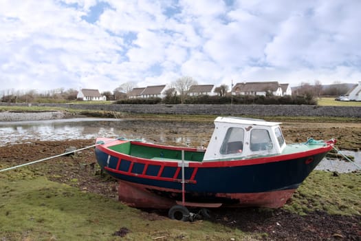 an old boat in a bay in ireland