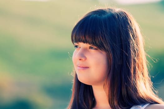 Outdoors portrait of a beautiful young lady
