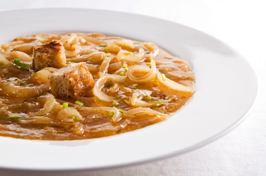 Fresh traditional french onion soup close up