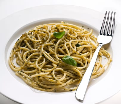 Spaghetti with pesto sauce close up shoot