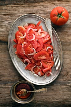 Fresh tomato with onion salad close up shoot