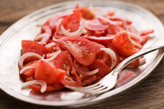Fresh tomato with onion salad close up shoot