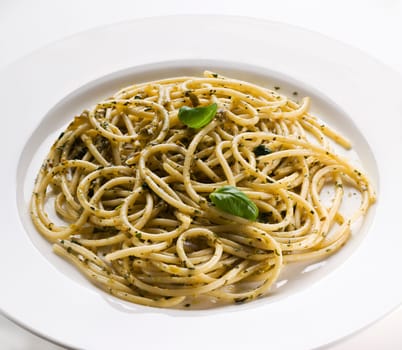 Spaghetti with pesto sauce close up shoot