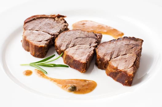 Roasted deer meat sliced close up shoot