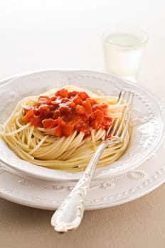 Fresh spaghetti with tomato sauce close up