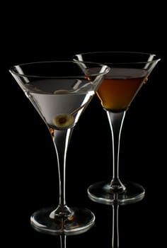 Fresh martini with olive on black background
