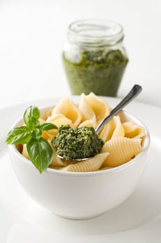 Fresh conchiglioni pasta with basil pesto sauce