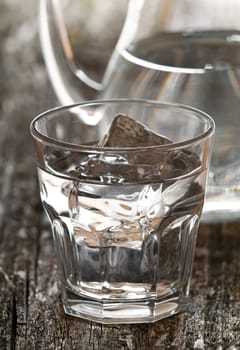 fresh water in glass with ice close up