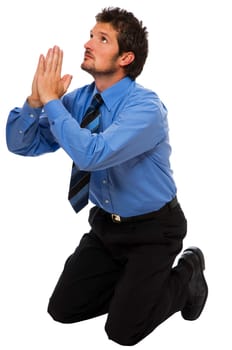 young Business man on his knees praying