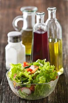 Fresh salad with vinegar, olive oil and salt close up