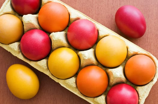Colorful easter eggs in a box close up