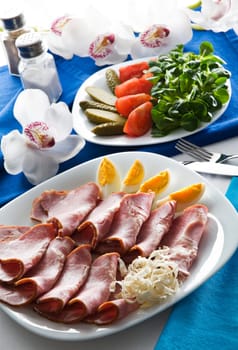 Fresh easter ham with eggs close up shoot