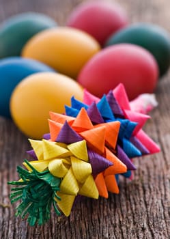 Easter butarica and colorful eggs on wooden background
