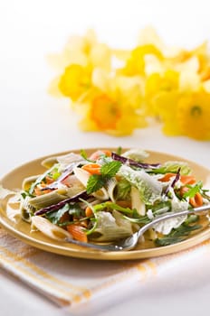 Fresh green salad with pasta close up shoot