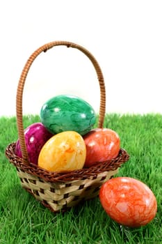 Various colorful Easter eggs on a lawn